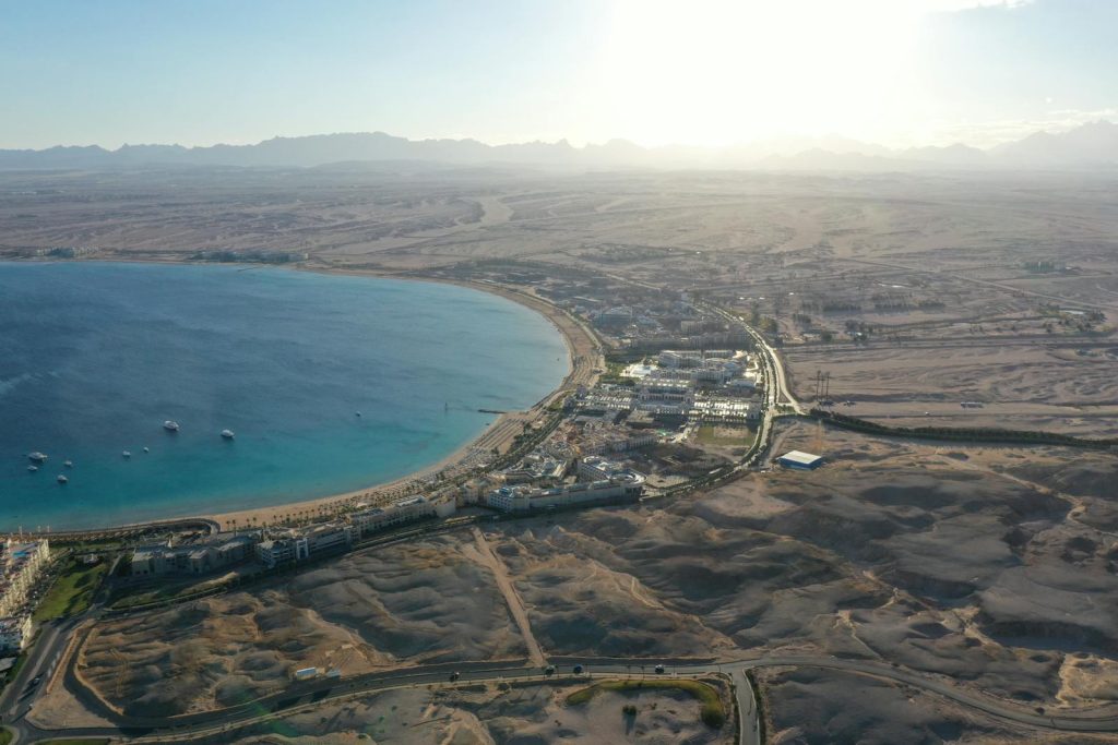 Stunning drone shot of Hurghada's coastline and desert panorama during sunset.